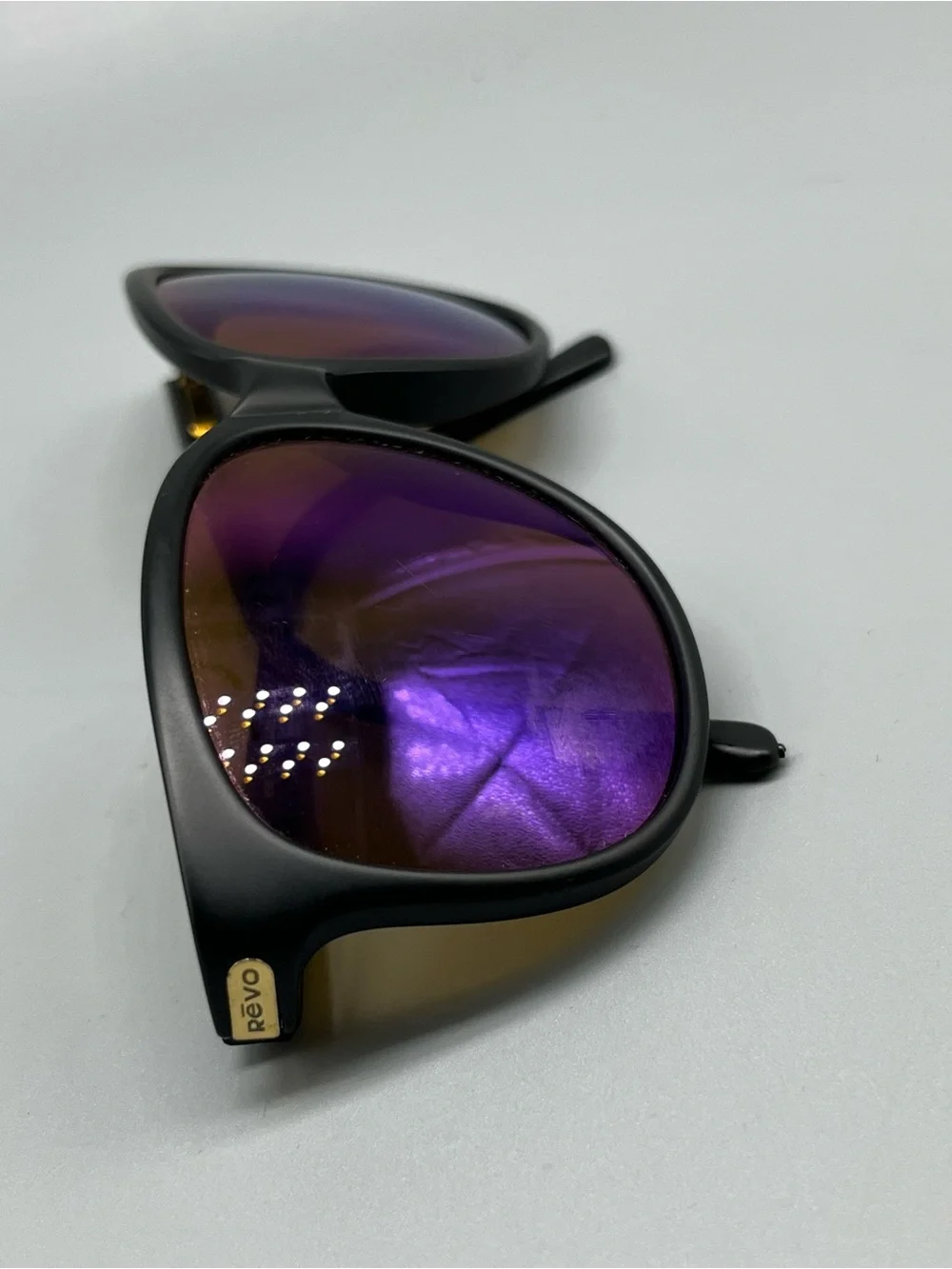 Revo Matte Black Sunglasses with Purple Mirrored Lenses